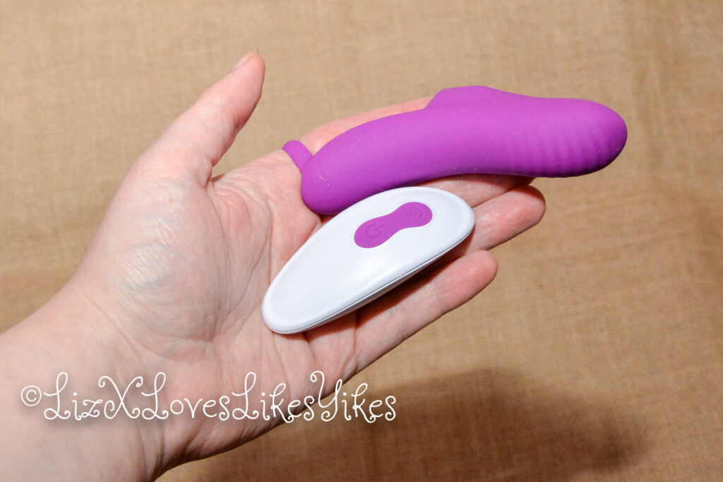 G Spot Finger vibrator with remote control - Paloqueth Vibrator and remote shown in my hand. Copyright LizXLikes