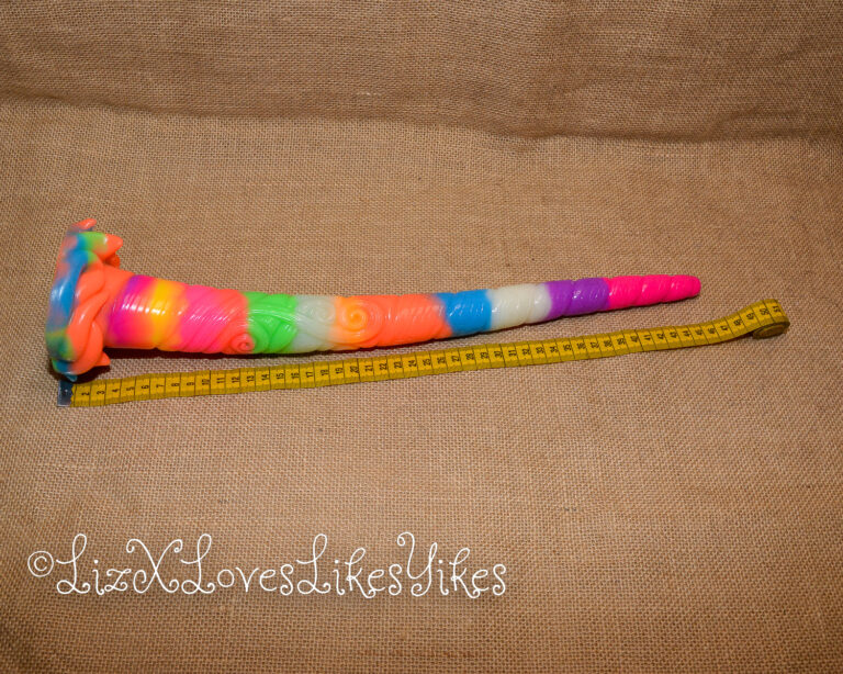 Measuring tape shows it's 42 centimetres long. Review of the Depth Training Unicorn Tentacle Anal Dildo Luminous BigShocked.com Copyright Liz BlackX
