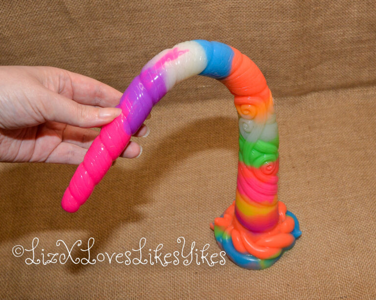 The product bended over with my fingers. Review of the Depth Training Unicorn Tentacle Anal Dildo Luminous BigShocked.com Copyright Liz BlackX