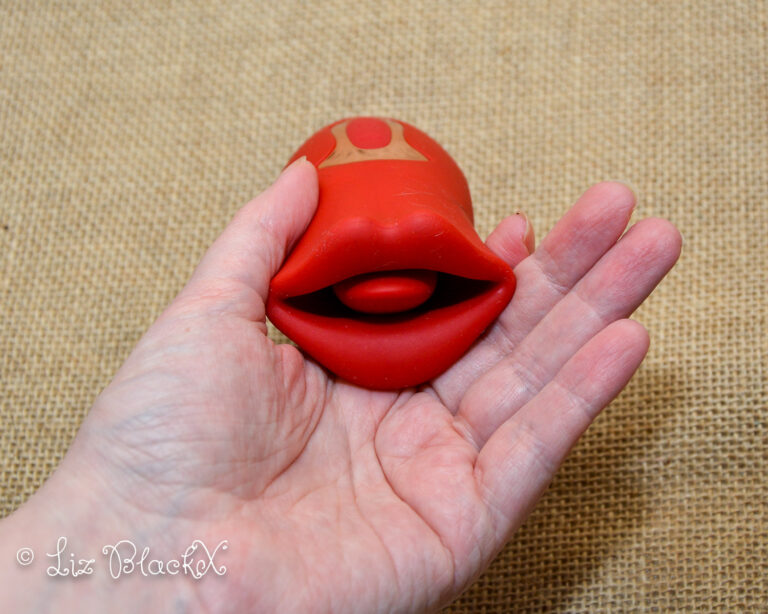 The vibrator as seen in my hand. Licking & Sucking Vibrator from Inyarose - A Giggle-Inducing Orgasmic Experience Copyright Liz BlackX