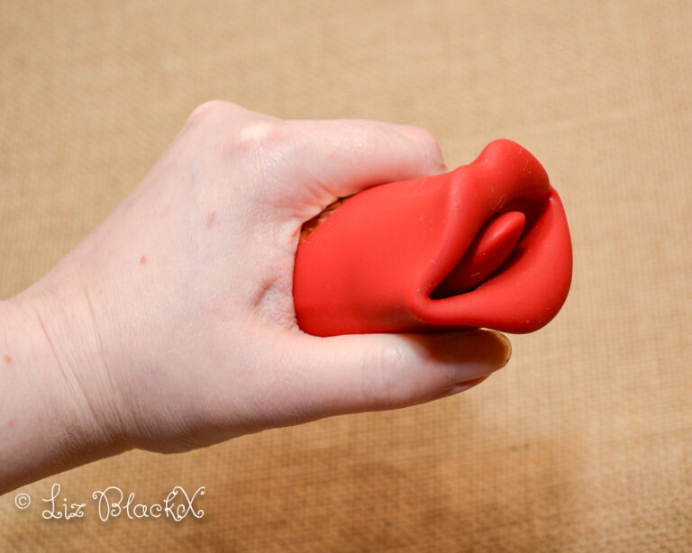 The vibrator as seen enclosed in my hand. Licking & Sucking Vibrator from Inyarose - A Giggle-Inducing Orgasmic Experience Copyright Liz BlackX